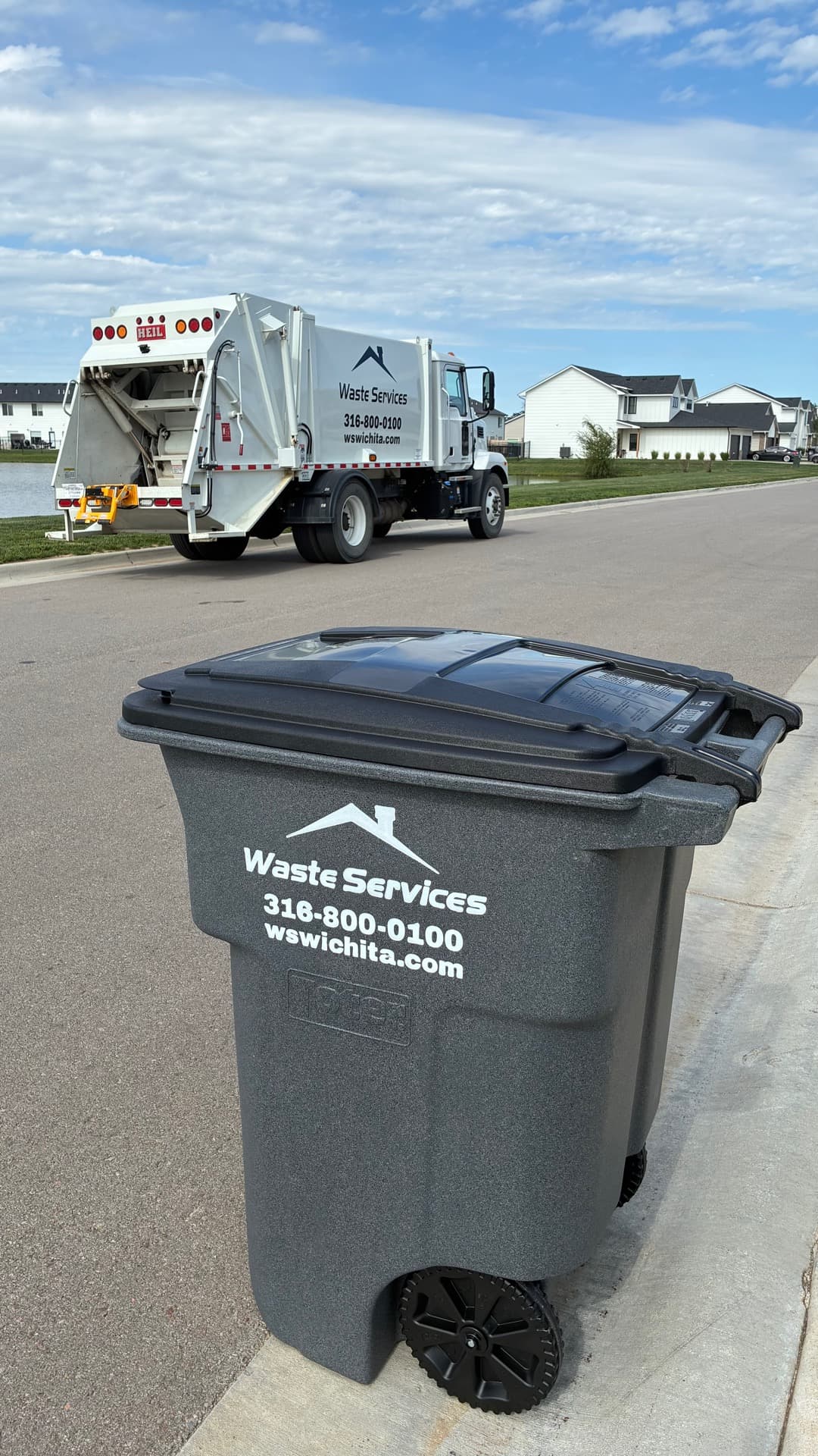 Waste Services cart and truck in a Wichita neighborhood